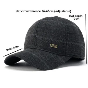 Detail view of winter baseball cap with ear flaps and metallic side logo plaque