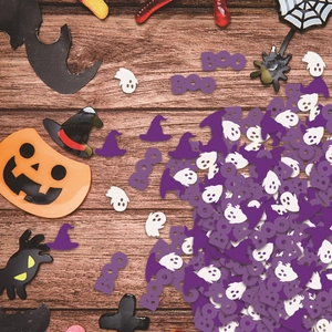 Halloween party confetti with purple BOO letters, ghosts and witch hats on wood