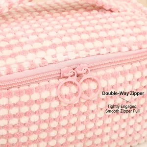 Pink and white checkerboard plush makeup bag with dual ring zippers and large capacity