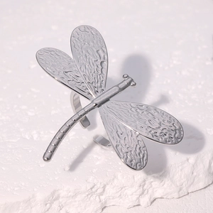 Minimalist silver dragonfly open ring with detailed textured wings in a stylish design