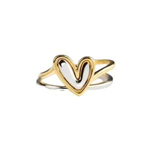 Minimalist heart-shaped ring in two-tone gold and silver finish with smooth round band