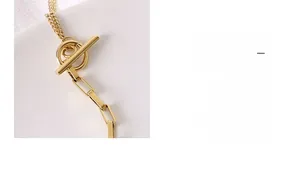Detail of 18K gold-plated titanium steel necklace with vintage OT toggle clasp