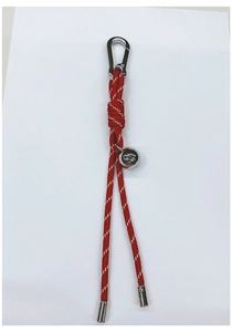 Detail of red and white braided lanyard featuring a silver metal ball and spring clasp