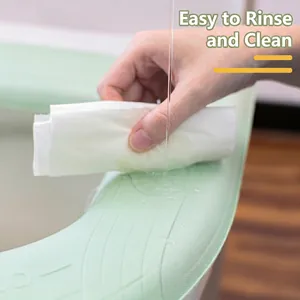 Waterproof light green EVA toilet seat cover with handle featuring anti-slip texture