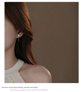 Detailed close-up of S925 silver iridescent rose earrings with elegant long tassel fringe