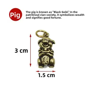 Pendentif cochon en laiton avec symbole de richesse, dimensions de 3 cm par 1,5 cm