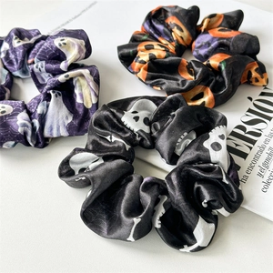 Three-piece Halloween hair scrunchies set featuring ghost, pumpkin, and skull patterns
