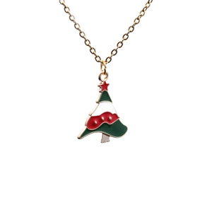 Christmas tree alloy necklace with red green and white enamel pendant on white background