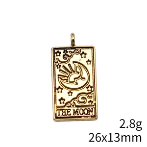 Detailed macro view of The Moon tarot pendant in vintage gold showing 26x13mm dimensions
