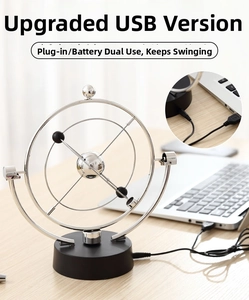 USB celestial orbit kinetic motion model showing silver rings and black base on desk