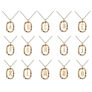 Colorful zircon initial necklaces with gold finish displayed in a 3x5 matrix layout