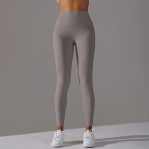 Detail view of high-waist yoga leggings in charcoal grey with seamless stretch fabric