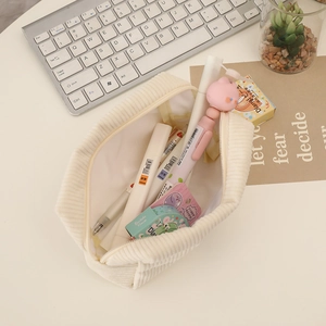 Detail of floral corduroy pencil case showing zipper opening and interior storage space