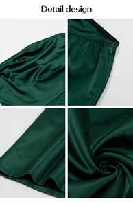 Detailansicht des smaragdgrünen Satin-Kleids mit Reißverschluss und eleganten Taillenfalten
