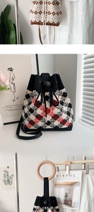 Detail view of thickened knit bucket bags with drawstring closure and geometric patterns