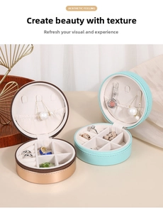 Macro shot showing internal compartments and necklace hooks of round PU jewelry boxes