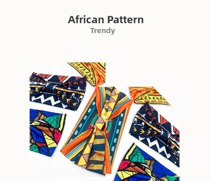 Flat lay of multiple African print elastic headbands with vibrant geometric patterns