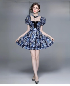 Detailed blue floral summer dress with lace collar and elegant black bow decoration