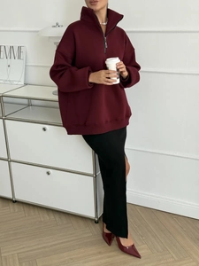 Chic burgundy oversized half-zip sweatshirt with a high collar and a thick cotton texture