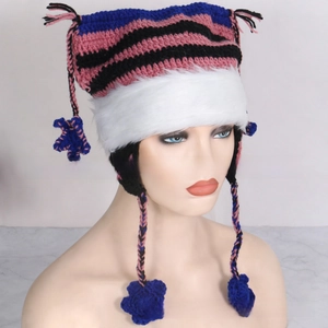 Detail of knitted cat ear hat with stars, striped pattern and faux fur trim