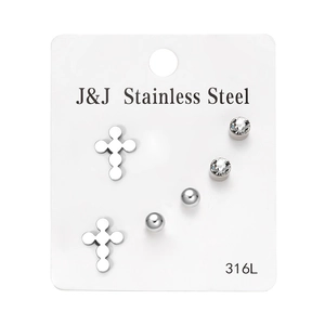 Detailed view of 3 pairs of 316L stainless steel studs with cross and zircon designs