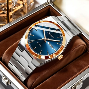 Close-up of dual calendar men's steel watch with dark blue dial in a display box