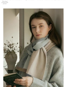 Detail view of the soft knit texture and multicolor patchwork design of the warm scarf