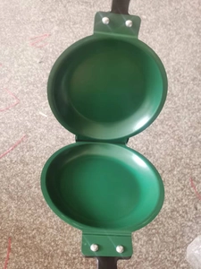 Detail view of the green non-stick double-sided folding omelette pan and breakfast griddle