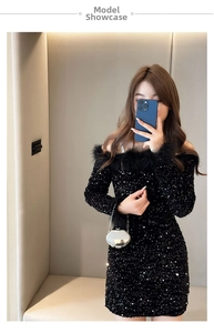 Close-up of black sequined off-shoulder party dress featuring elegant feather trim detailing