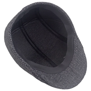 Inside view of men's tweed flat cap showing skin-friendly lining and stitching