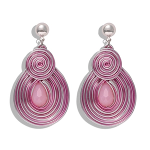 Detail of bohemian wire-wrapped heart earrings with pink teardrop gems and pearls