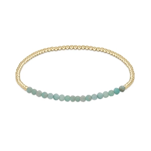 Handmade layered natural stone beaded bracelet with gold accents and light blue gemstones