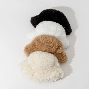 Plush faux fur bucket hats in black, white, camel and beige for winter warmth
