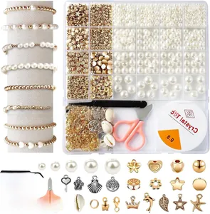 DIY jewelry kit with white faux pearls and gold alloy charms in 24-grid organizer box