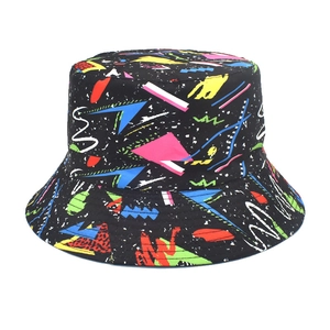 Detail view of the black graffiti bucket hat featuring vibrant retro geometric patterns