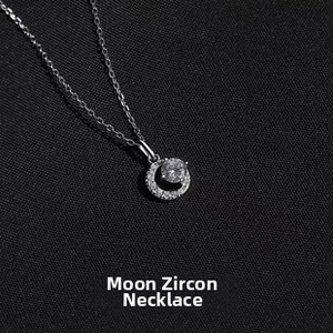 Detail view of sterling silver moon pendant necklace featuring elegant zircon stones