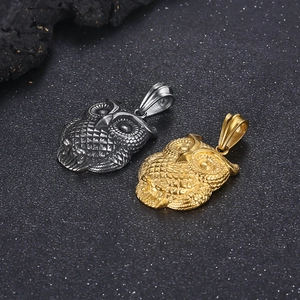 Detailed relief of owl pendants in gold and silver finishes on textured black background