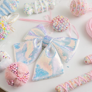 Pink sequin Christmas bow decoration with iridescent macaron finish for festive tree decor