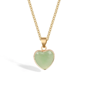 Minimalist gold chain necklace with a smooth green heart crystal pendant on white background