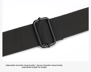 Detail of adjustable black shoulder strap with sturdy metal buckle on crossbody bag