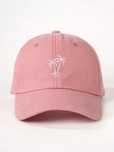 Detailed close-up of white palm tree embroidery on a pink cotton baseball cap for women
