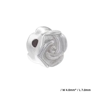Detailed macro view of 18K gold plated silver flower spacer bead with 4x7mm dimensions