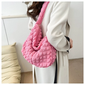Detailed texture of pink bubble hobo bag with unique 3D pleat and waffle fabric design