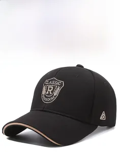 Close-up of fine embroidery and shield patch on this black cotton baseball cap