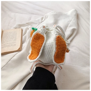 Handmade crochet drawstring bucket bag featuring cute carrot ears and knit texture