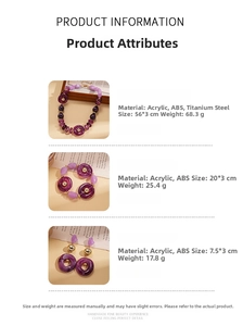 Macro detail of bohemian purple acrylic beaded necklace and earrings on vintage paper