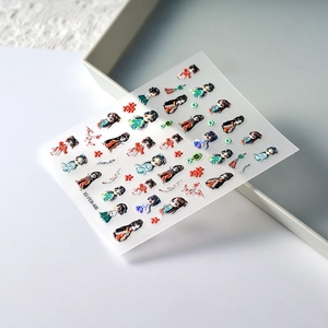 Detailed macro of 5D embossed nail art stickers featuring Chinese folk style characters