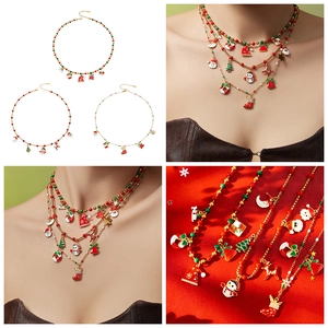 Macro details of festive multi-layer Christmas necklaces with Santa and reindeer charms