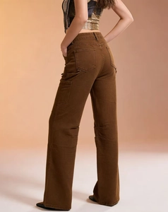 Detail view of the back pockets and high waist cut on brown cargo denim jeans