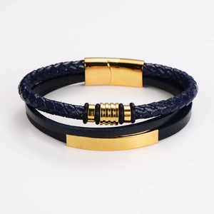 Close-up of double-layer navy braided leather bracelet with golden magnetic clasp